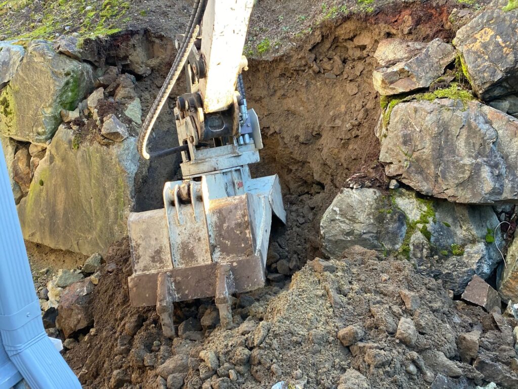Construction equipment repairing walls.
