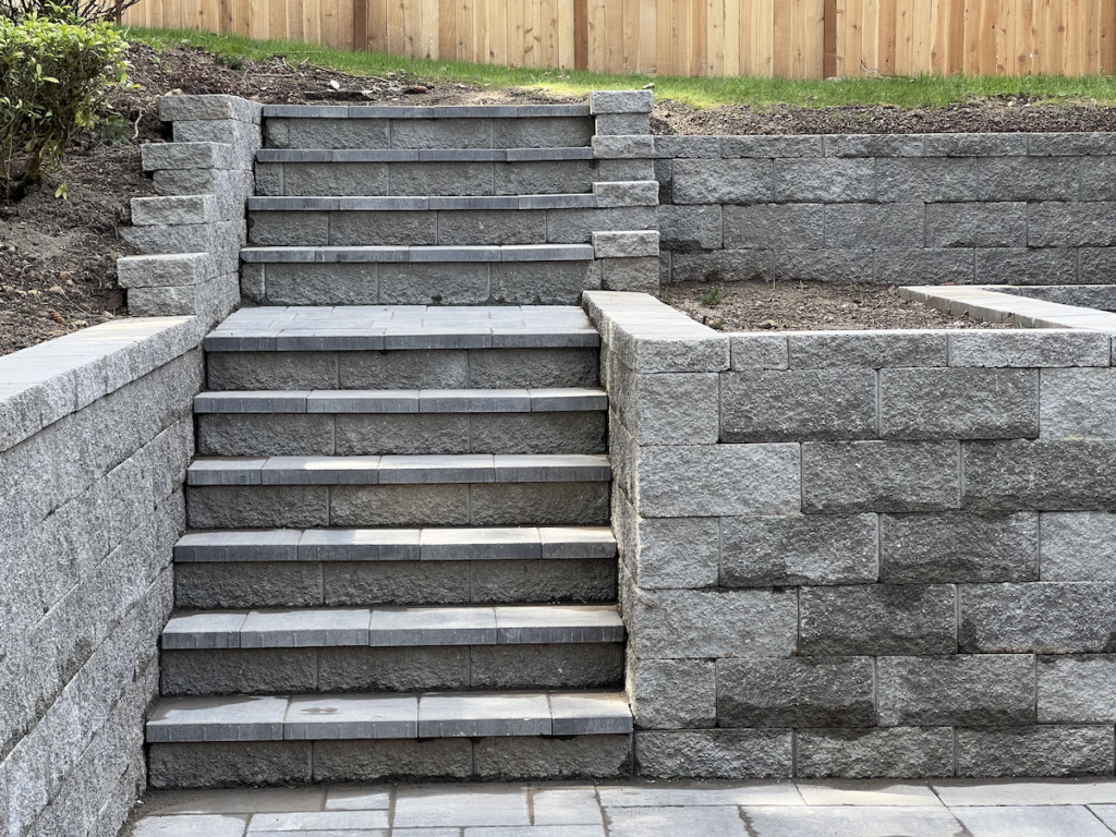Bellevue WA retaining wall with stone steps installation.