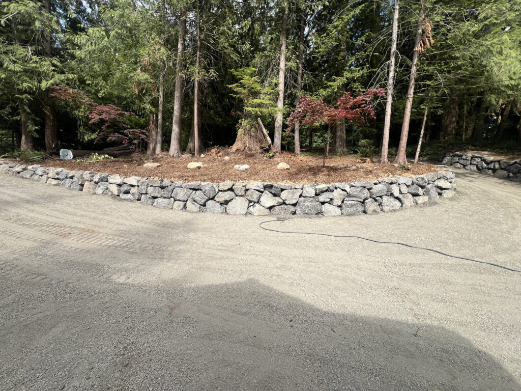 Issaquah WA curved rock retaining wall landscape project