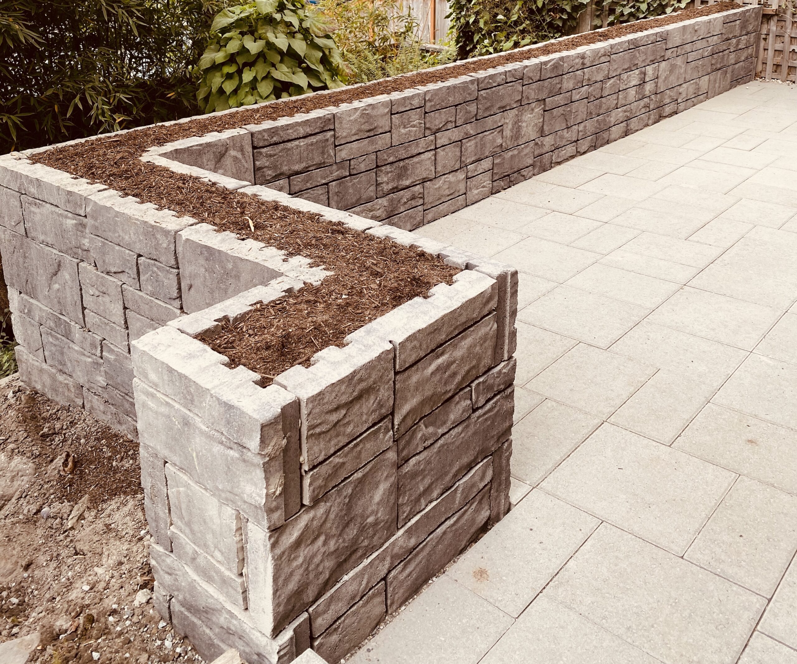 Block wall in the back yard with angle corner. Seattle, WA