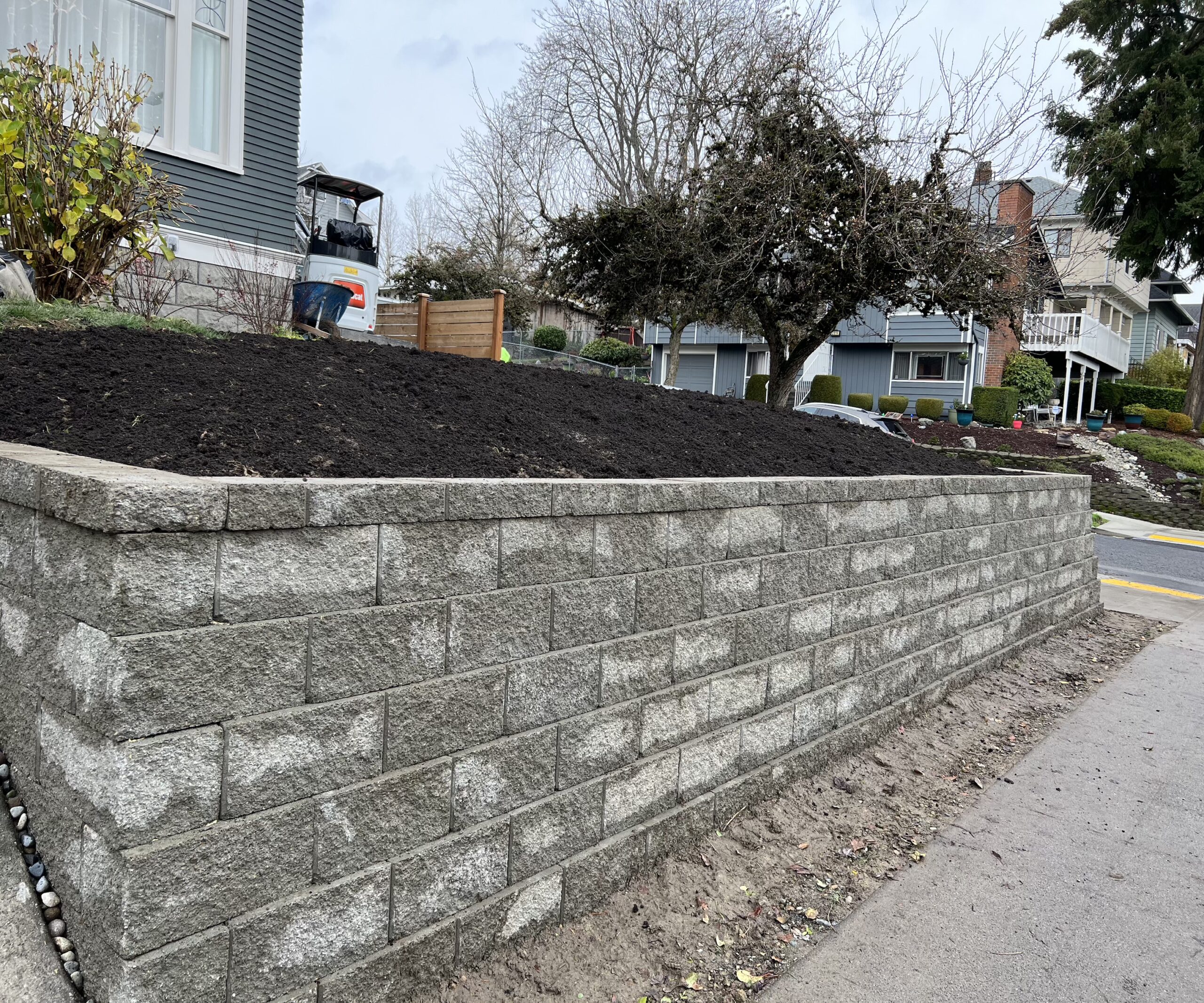 Block wall in front yard with straight design. Seattle, WA