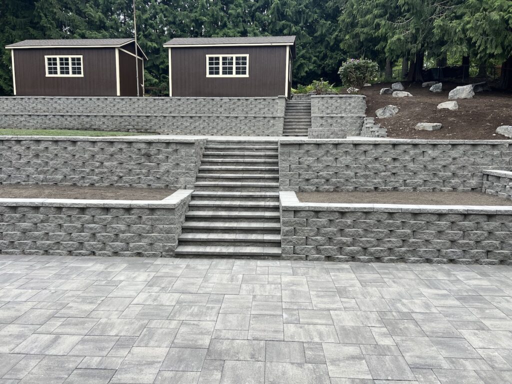 Block wall with custom steps and risers in backyard. Kent, WA.