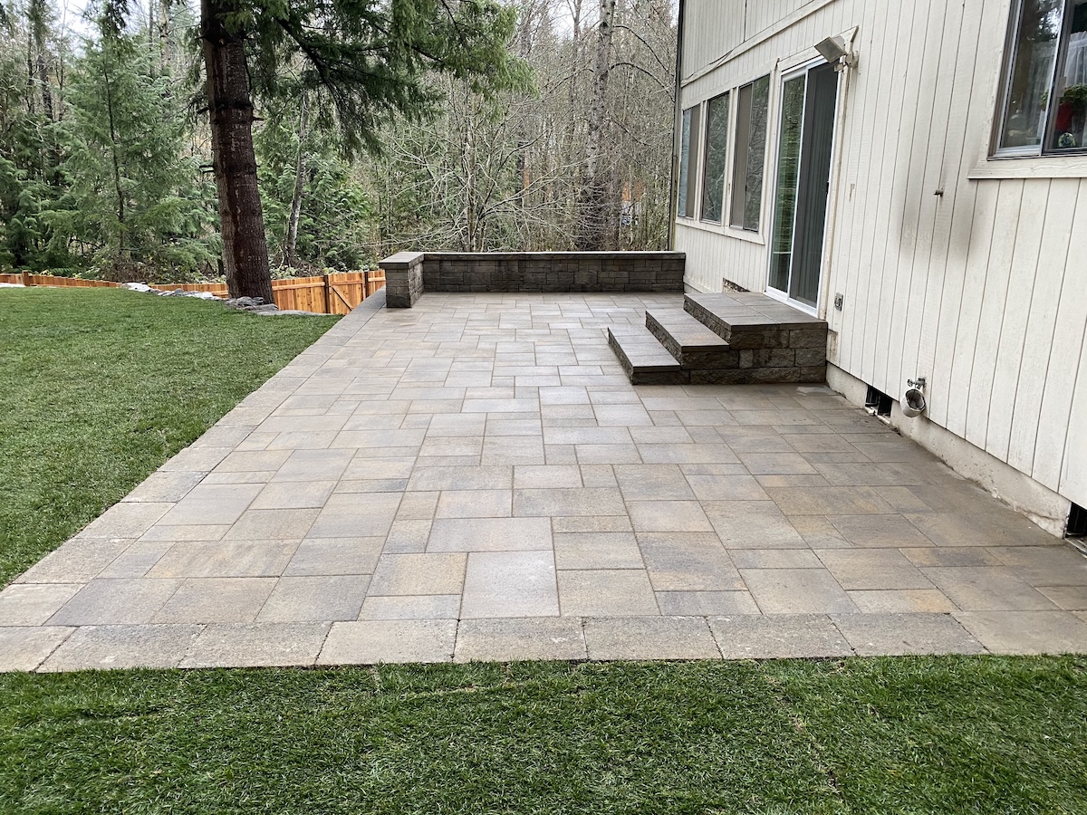 Custom pavers and steps in Kent home backyard.