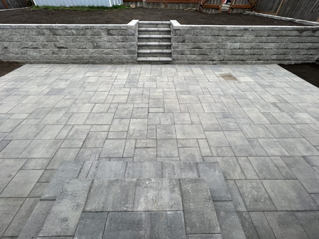 Tacoma block wall, custom steps, and pavers.